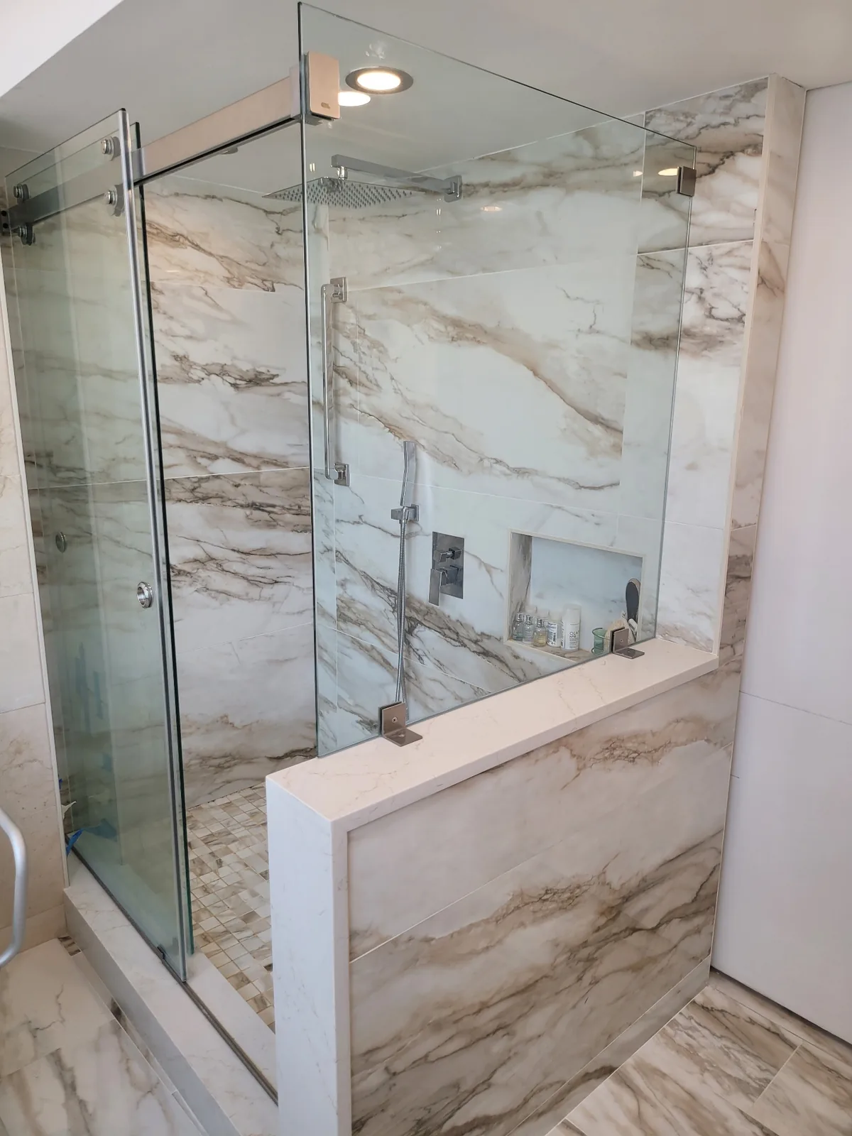 Calacatta marble walk-in shower with glass enclosure in Bergen County NJ