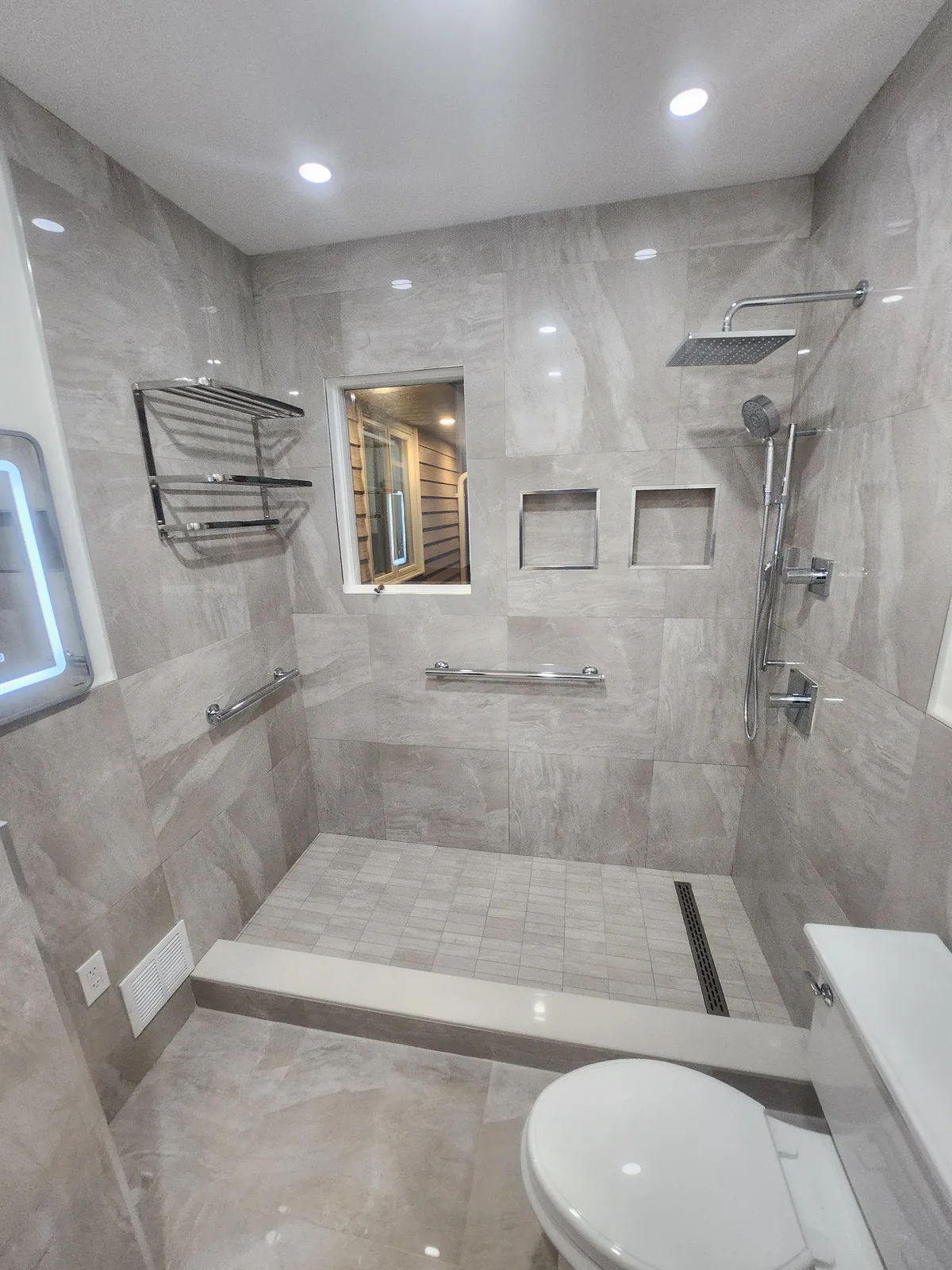 Curbless walk-in shower with rain head in a Bergen County NJ bathroom