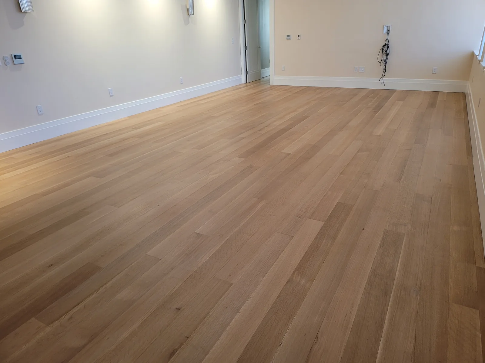 Wide-plank hardwood floor refinishing project in Bergen County NJ