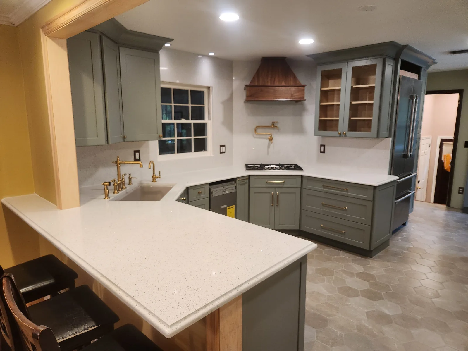 Updated kitchen with quartz counters and tile backsplash in Bergen County NJ