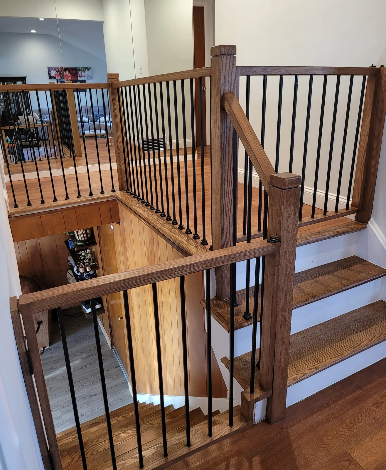 Hardwood stair tread and iron baluster install in Bergen County NJ